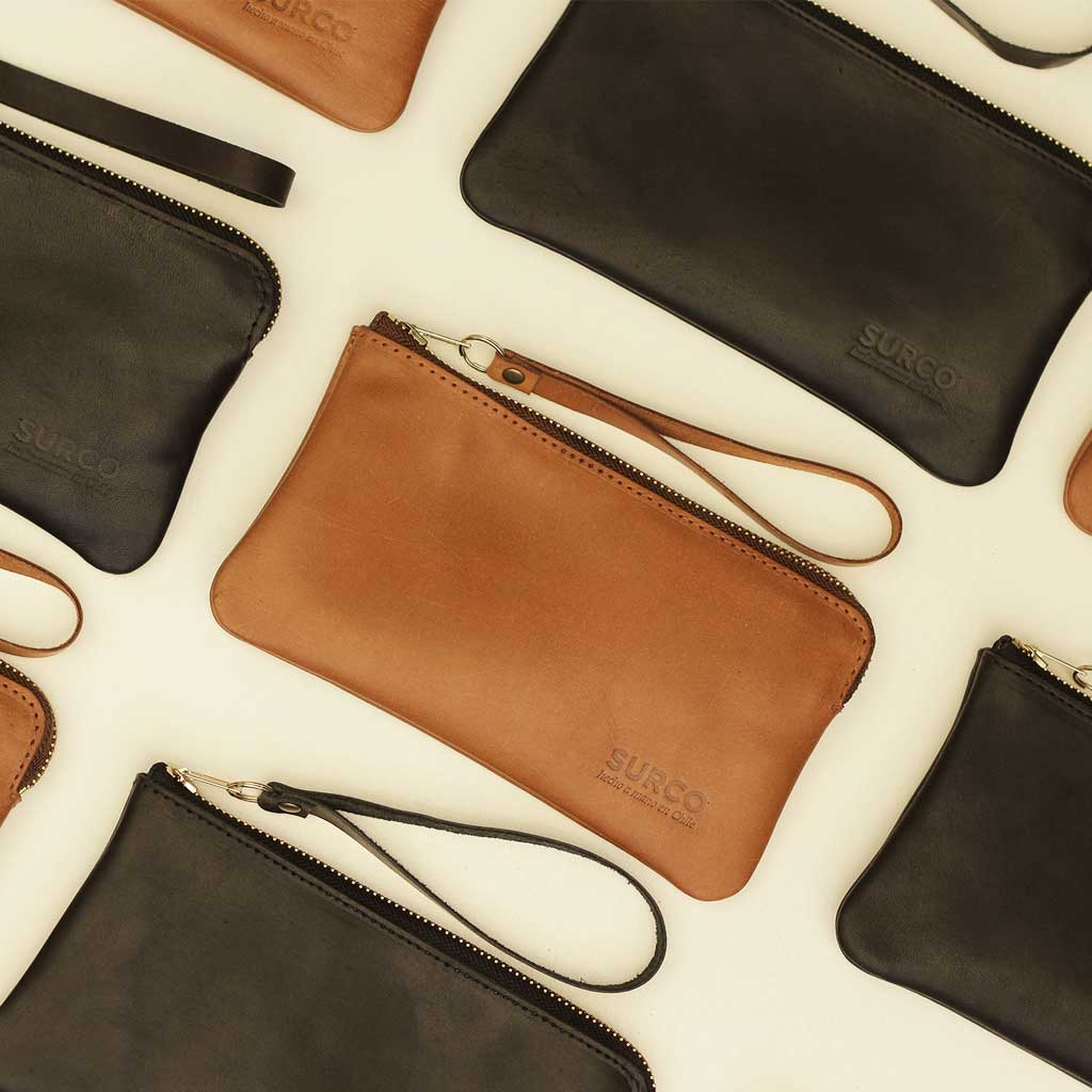 Billetera de mujer y clutch de mano hecho en cuero