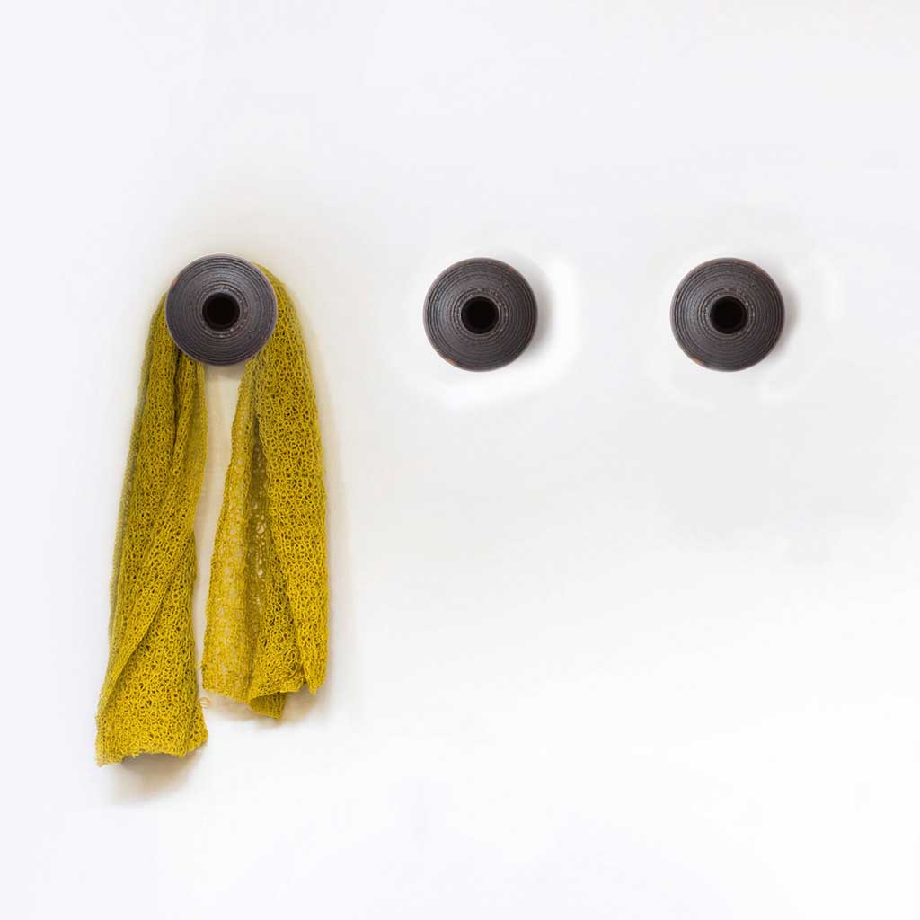 Clay Dots, perchas para muro hechas de greda